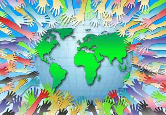 World map with cooperating hands from all nations.